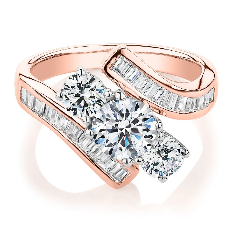 Women’s stackable wedding rings-Three stone ring with 2.63 carats* of diamond simulants in 10 carat rose and white gold