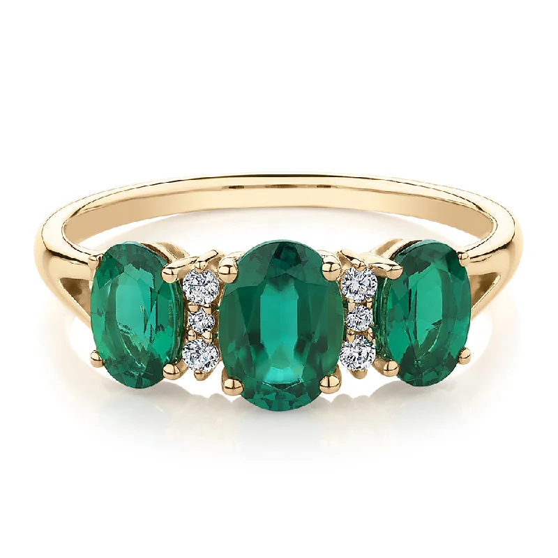 Women’s birthstone rings-Dress ring with emerald and diamond simulants in 10 carat yellow gold