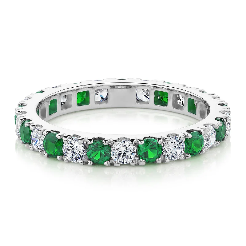 Women’s diamond rings-All-rounder eternity band with emerald simulants and 0.78 carats* of diamond simulants in 14 carat white gold