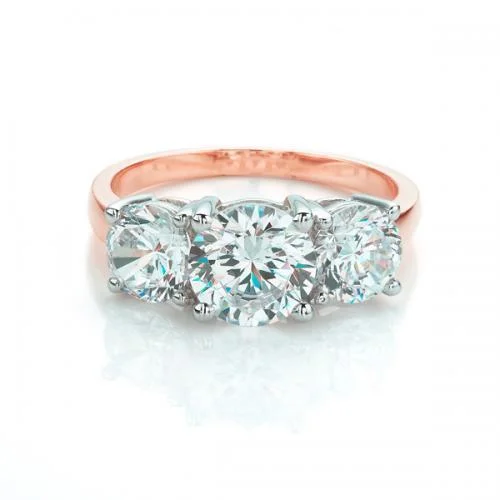 Women’s gold rings-Three stone ring with 3 carats* of diamond simulants in 10 carat rose and white gold