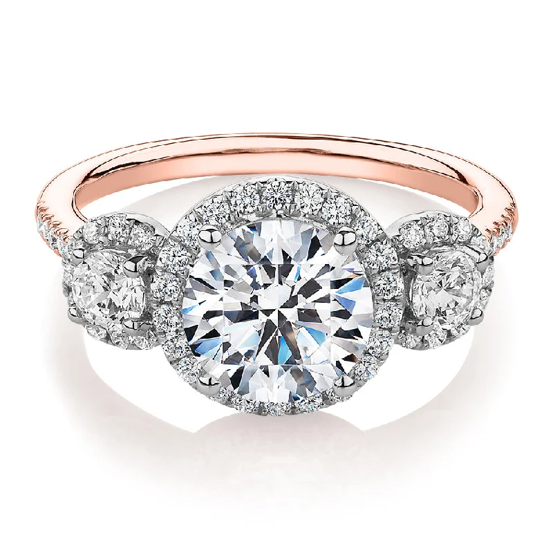 Women’s thick rings-Three stone ring with 2.68 carats* of diamond simulants in 10 carat rose and white gold