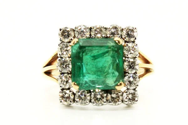 Women’s cocktail diamond rings-Emerald And Diamond Split Shank Halo Ring Ad No.1128