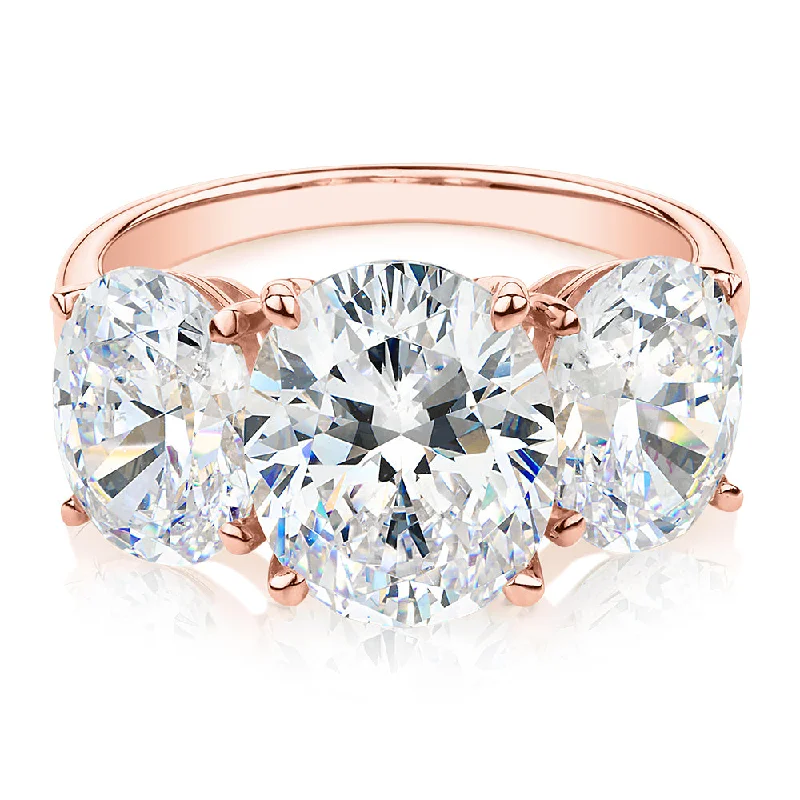 Women’s platinum rings-Three stone ring with 7.57 carats* of diamond simulants in 10 carat rose gold