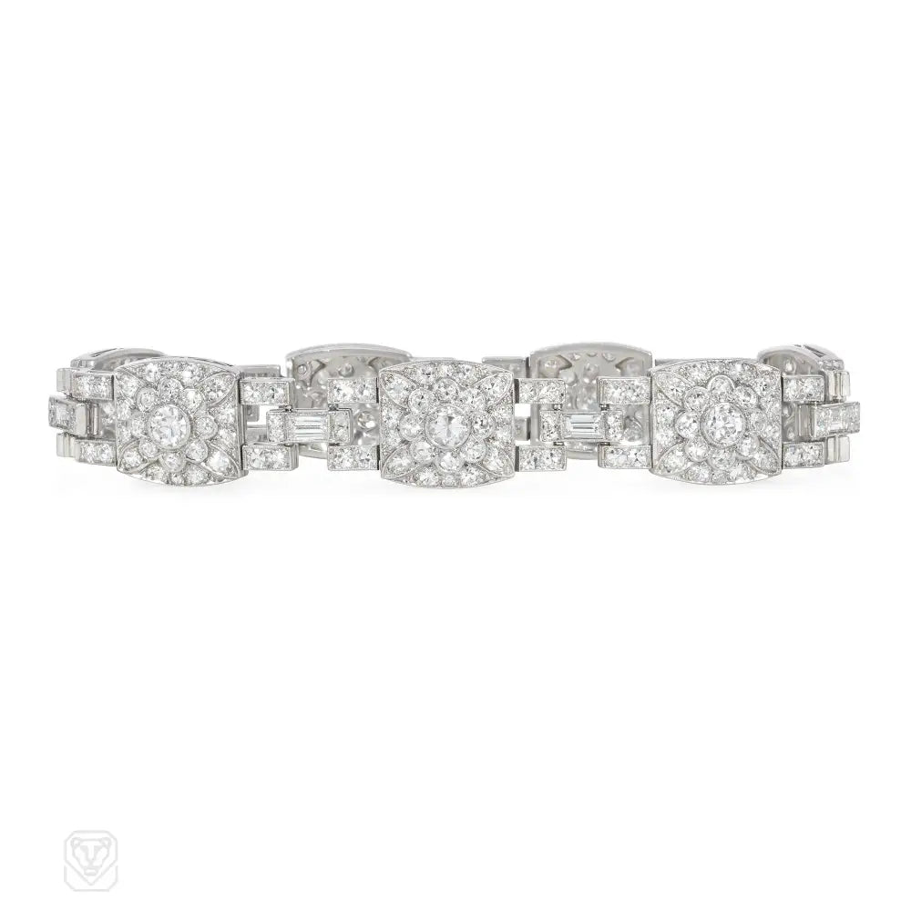 Women’s gemstone bangle-1920s platinum and diamond floral motif bracelet