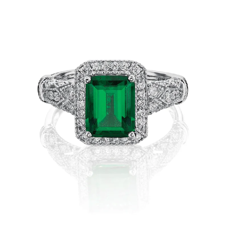 Women’s statement diamond rings-Dress ring with 9x7mm emerald simulant and 0.27 carats* of diamond simulants in 10 carat white gold