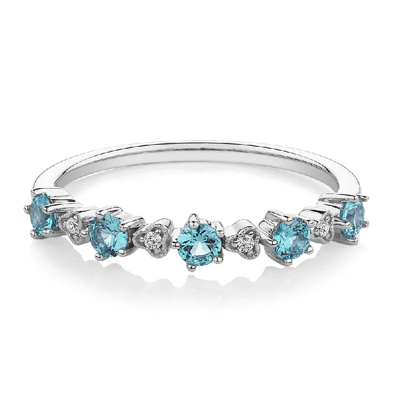 Women’s romantic promise rings-Wedding or eternity band with blue topaz and diamond simulants in 10 carat white gold