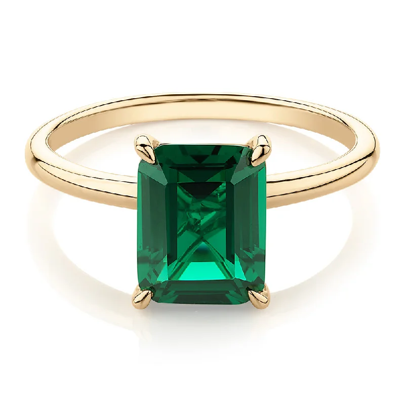 Women’s promise rings-Dress ring with emerald simulant in 10 carat yellow gold