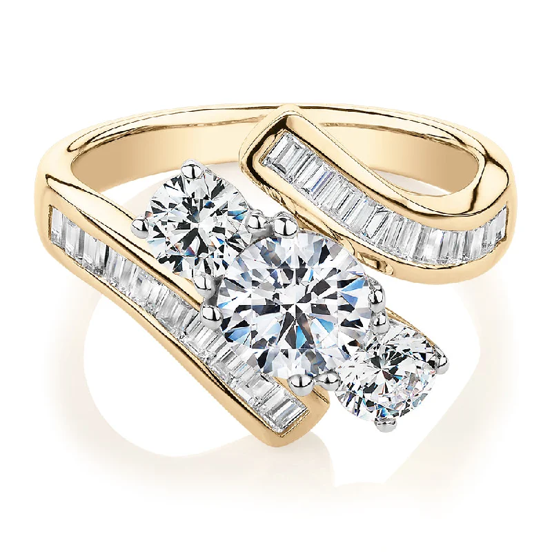 Women’s engagement rings-Three stone ring with 2.63 carats* of diamond simulants in 10 carat yellow and white gold