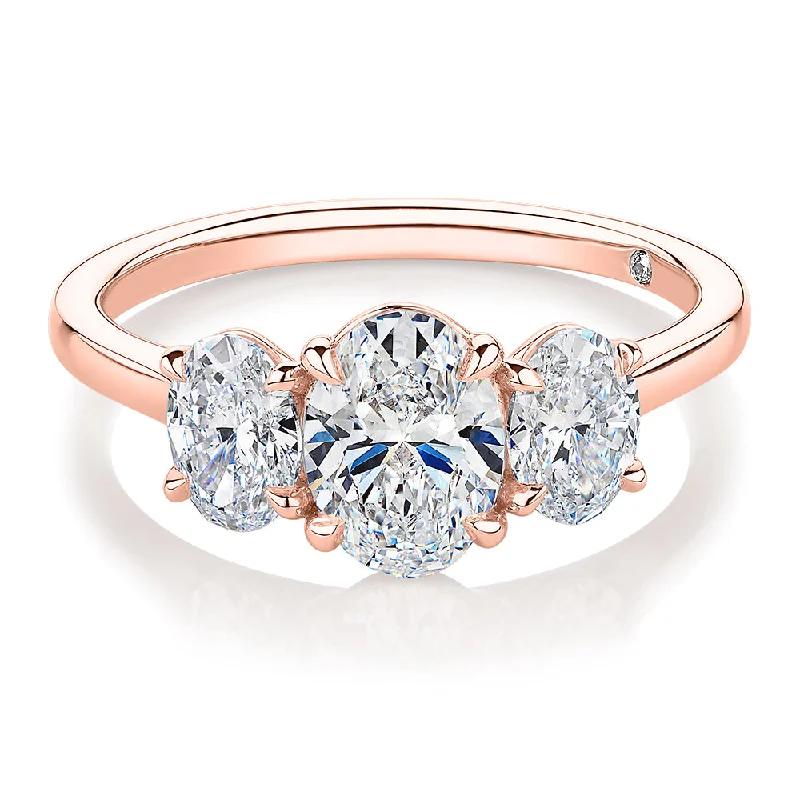 Women’s designer rings-Signature Simulant Diamond 1.87 carat* TW oval three stone ring in 14 carat rose gold